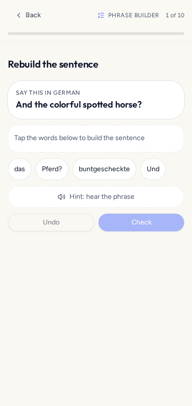 Tildi Phrase Builder game showing a German sentence to rebuild from word tiles